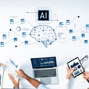 People sitting at a desk and working together using AI